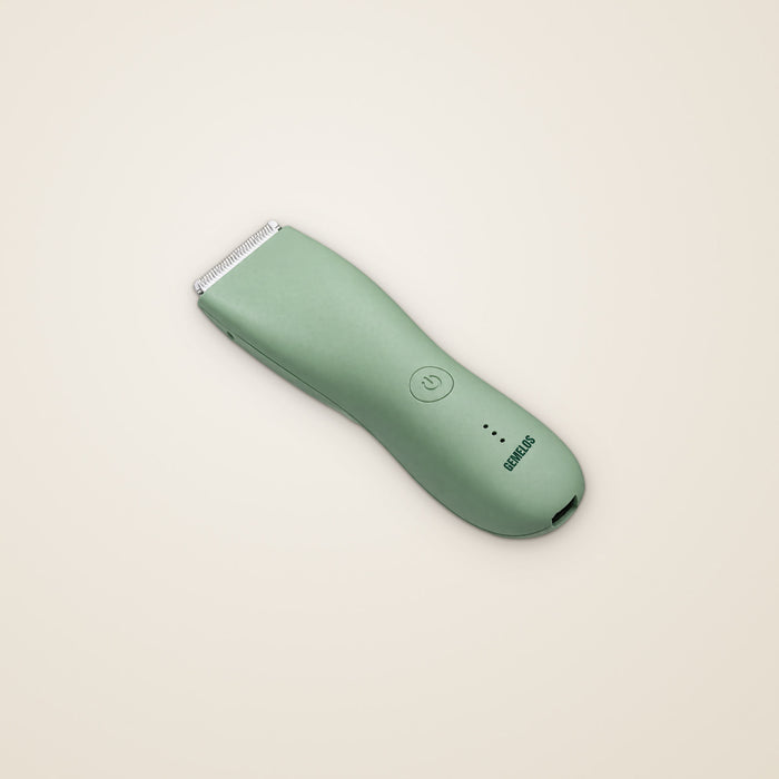 Recortadora íntima verde, vista en ángulo, con el logo GEMELOS en el cuerpo